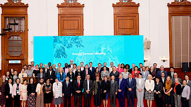 Group of delegates participating in the U21 meeting, in a hall at the University of Hong Kong.